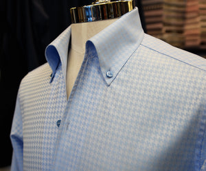 A blue houndstooth button-down Anto sport shirt, showcased on a mannequin.