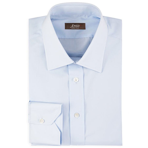 Anto light blue poplin dress shirt, neatly folded, showcasing the fabric's texture and the shirt’s elegant design.