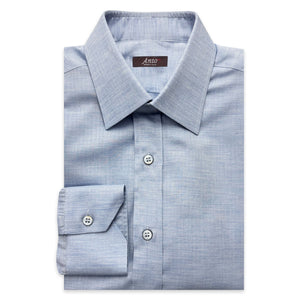 Folded light blue herringbone dress shirt