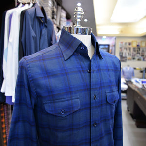 A blue check Anto sport shirt with two pockets, showcased on a mannequin.