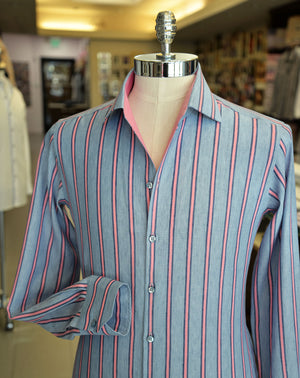 Light blue and pink stripe linen sport shirt, showcased on a mannequin.
