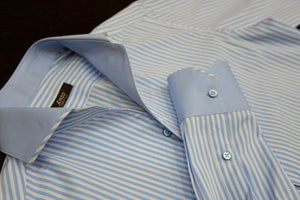 An Anto sport shirt laid flat on a surface, showcasing the detail work and craftsmanship. 