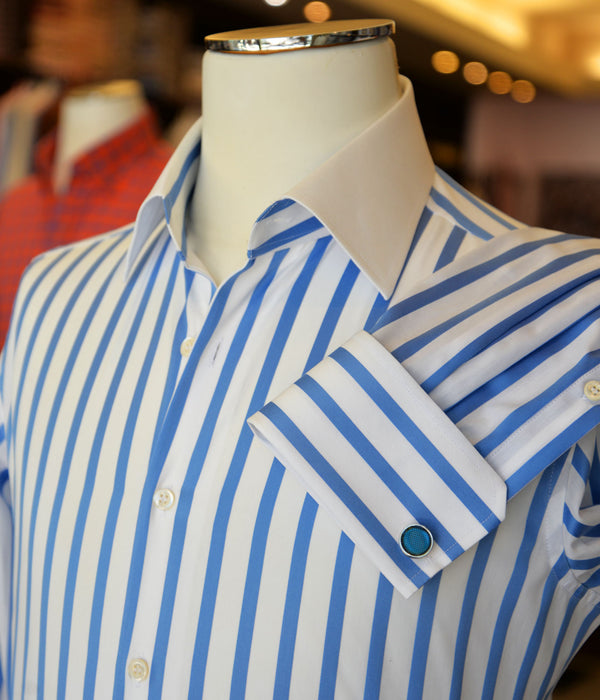 Blue and white striped shirt with French cuffs on a mannequin.