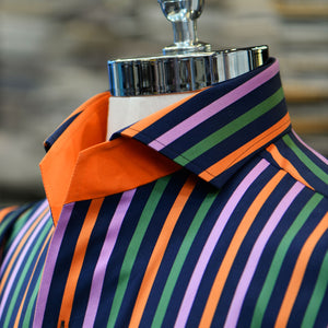 A multi-color Anto sport shirt with orange details, showcased on a mannequin. 