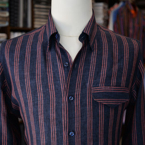 A navy and pink linen stripe sport shirt with a pocket, showcased on a mannequin. 