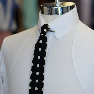 White Anto shirt featuring a pin collar and shoulder harness, displayed on a mannequin.
