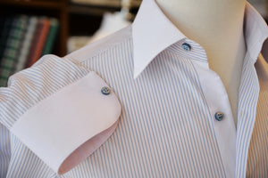 Anto pink stripe shirt with a solid pink collar and cuffs, showcased on a mannequin.