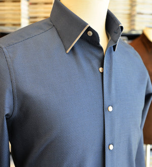 Blue textured shirt on a mannequin