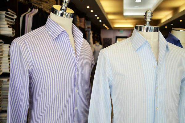 A purple stripe shirt and a blue stripe shirt on mannequins
