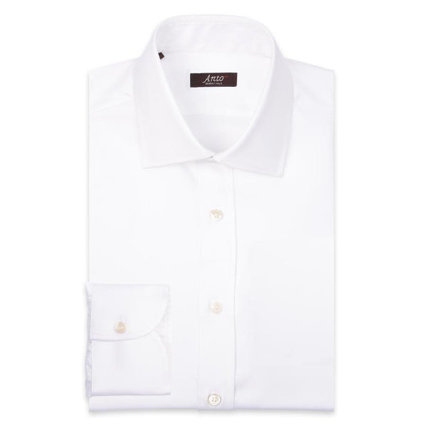 Anto white twill dress shirt, neatly folded, showcasing the fabric's smooth texture and elegant design.